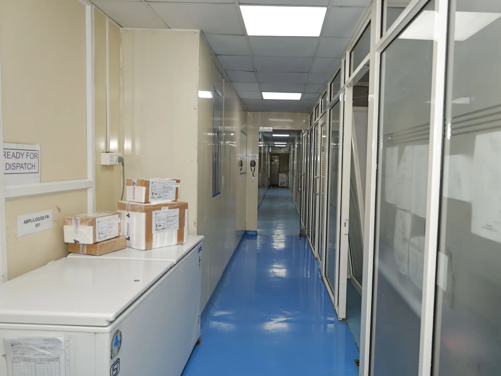 Packed orders at the ready-for-dispatch point in the clean-room corridor at the Chinchwad plant